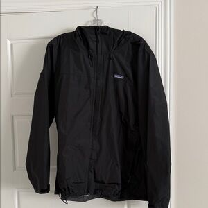 Patagonia woman’s black jacket with hood